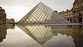 The new entrance to the Musee du Louvre,  a pyramidal,  glass structure designed by renowned American architect I M Pei  Paris,  France