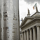 The Spike on O´Connell Street,  backgroundIrish flag on top of the GPO Building , Dublin,  Ireland