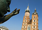Poland,  Krakow,  Monument of great Polish poet Adam Mickiewicz,  detail and St mary´s Basilica
