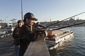 fishing from the Galata Bridge, Istanbul, Turkey