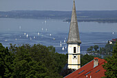 View over Chiemsee with church, Umratshausen, Lake Chiemsee, Chiemgau, Bavaria, Germany