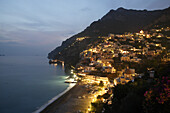 View of Positano in the evening light with cliffside homes, Amalfi Coast, Italy