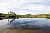 Reflections of clouds on a lake at late summer, Trondelag, Norway, Scandinavia, Europe