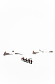 Group of snowboards ascending, Oberlaeger Alp, Reichenbach Valley, Bernese Oberland, Canton of Bern, Switzerland