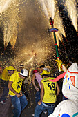 People lighting firecrackers, Festival of Santa Tecla, Sitges, Catalonia, Spain, Europe