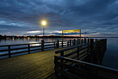 Jetty at lake Chiemsee in the evening, Fraueninsel, Bavaria, Germany