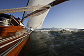 Sailing yacht on lake Chiemsee, Fraueninsel, Bavaria, Germany