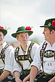 Three young men wearing traditional costumes, May Running, Antdorf, Upper Bavaria, Germany
