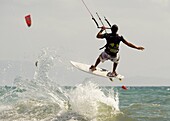 Adult, Beach, Equipment, Exercise, Fit, Fly, Flying, Fun, Horizontal, Jump, Jumping, Kite, Kitesurf, Kitesurfing, Man, Outdoors, Sea, Sport, Surf, Surfer, Water, Wind, Windy, A75-949957, agefotostock 