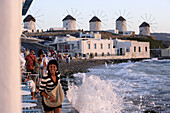 People on the terrace of a bar in the evening sun, Little Venice, Mykonos Town, Greece, Europe