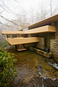 An approach side view of Fallingwater shows the home´s famous cantilevered balconies and a sculpture by Lipchitz lower right  Also known as the Edgar J  Kaufmann Sr  Residence, Fallingwater was designed by American architect Frank Lloyd Wright in 1934 i