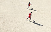 african emigrant soccer players, old river bed Turia in Valencia, Spain