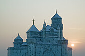 China. Heilongjiang. HAERBIN  Harbin): Haerbin Ice and Snow World Festival. All Buildings built of ice. Ice Church at Sunset