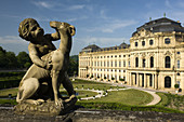 Residenz Palace and cherub with dog statue, Wurzburg, Bavaria, Germany