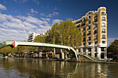 Canal Saint-Martin, canal footbridge and building, Paris, France