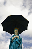La Vierge au Parasol¨ Virgin Mary with parasol as protection against the volcano, Notre Dame des Laves church, Piton Sainte-Rose, East Reunion, Reunion island, France