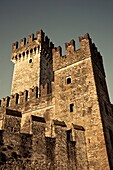 Italy, Lombardy, Lake District, Lake Garda, Sirmione, Castello Scaligero castle, dawn