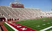 bleachers and field at Indiana University´s Memorial Stadium in Bloomington, empty, construction crane visible at one end