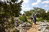 Hikers on their way to the Punta Goloritzé in the Golfo di Orosei, plateau Altiplano Su Golgo, Baunei, Sardinia, Italy, Europe