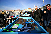 People at a stand at the fish market, Marseille, France, Europe