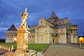Illuminated baptistery and Pisa cathedral with fountain in the foreground, Pisa, UNESCO world heritage site, Tuscany, Italy