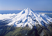 Mount Taranaki / Egmont with Mts Tongariro Ngauruhoe and Ruapehu in distance left New Zealand