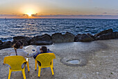 Couple enjoying the sunset over the mediterranean sea, Tel Aviv, Israel, Middle East