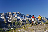 Two women hiking on the GR 5 Trek, Portes de l'Hiver, Val d'Illiez, Dents Blanches in background, Valais, Switzerland