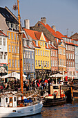 The picturesque historic Nyhavn Canal with pastel painted old town houses, Nyhavn, Copenhagen, Denmark