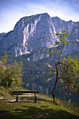 Bench near lake Altaussee, Trisselwand in background, Styria, austria