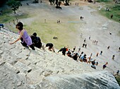 Tourists are climbing up the stairs to the pyramid. El Castillo, Yucatán, Mexico