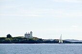 Sailing boat and small lighthouse, Haugesund, Norway