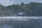 Boat house in rain at lake Konigssee, Berchtesgadener Land, Upper Bavaria, Germany