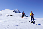 Two backcountry skiers ascending Hocheisspitze, Granatspitz mountain range, Hohe Tauern, Salzburg, Austria
