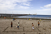 Boys playing beach soccer, Puerto Madryn, Chubut, Patagonia, Argentina, South America, America