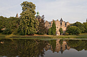 Bückeburg Castle and moat with reflection in the water, Bückeburg, Lower Saxony, northern Germany