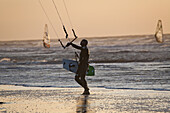 Kite surfer on the beach at St Peter-Ording, Evening light, Schleswig-Holstein, North Sea coast, Germany