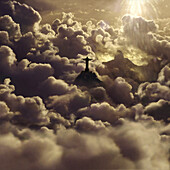 View at statue of Jesus Christ amidst cumulus clouds at sunset, Rio de Janeiro, Brazil, South America, America