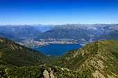 View from the mountain top of Monte Tamaro to Lago Maggiore with Locarno and the delta of the Maggia river, mountain hike to Monte Tamaro, Ticino, Switzerland