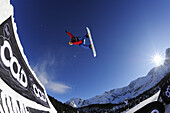 Snowboarder jumping from a kicker, performing a back-flip, funpark Ehrwalder Alm, Tiroler Zugspitzarena, Ehrwald, Tyrol, Austria