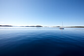 Sailing boat under blue sky at Kornati archipelago, Croatia, Europe