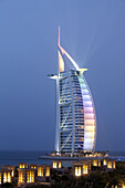 Medinat Jumeirah hotel view to Burj al Arab at dusk, Dubai, United Arabian Emirates