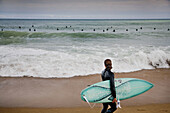 Surfing in La Barcelonata Beach, Barcelona, Catalonia, Spain