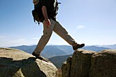 Appalachian Trail    A hiker on the summit of Mount Lincoln heading north on the Franconia Ridge Trail during the spring months  Located in the White Mountains, New Hampshire USA