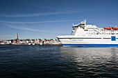 Ferry in harbor, old town in background, Travemunde, Lubeck, Schleswig-Holstein, Germany