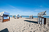 Roofed wicker beach chairs at beach of Wohlenberg, Boltenhagen, Bay of Mecklenburg, Mecklenburg-Vorpommern, Germany