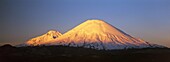 Vulcano Parinacota 6342m and Pomerape 6286m Chile are part of the Lauca National Park in the Altiplano of northern Chile  Lauca National Park is part of the Biosphere Reserve Lauca, The whole area is shaped by vulcanic processes  America, South America, C