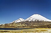 Vulcano Parinacota 6342m and Pomerape 6286m Chile are part of the Lauca National Park in the Altiplano of northern Chile  Lauca National Park is part of the Biosphere Reserve Lauca, The whole area is shaped by vulcanic processes  America, South America, C