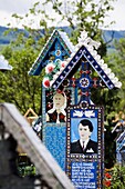 Merry Cemetery in Sapanta, Romania, maramures, is a world wide unique graveyard  the wooden crosses are painted and depict scenes from the life and death of the deceased  Often short texts full of humor tell stroies from the life of the dead  The merry ce