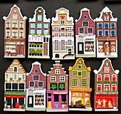 Many fridge magnets in shape of traditional dutch houses in Amsterdam Netherlands